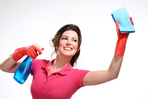 Technician wearing protective gear during carpet cleaning preparation
