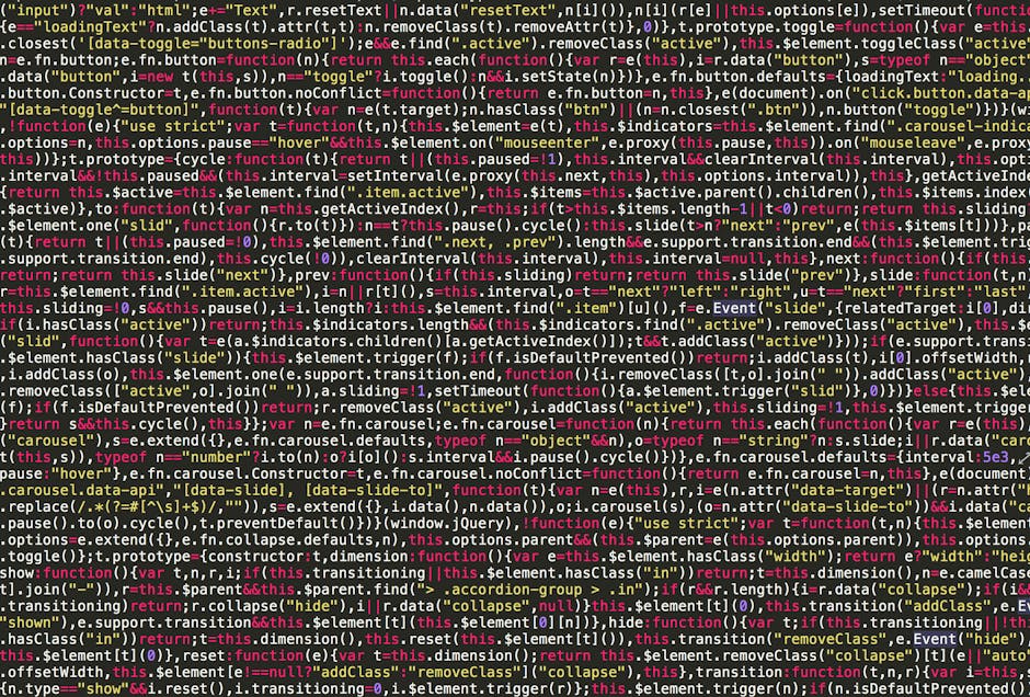 Close-up image of a computer screen displaying lines of multi-colored coding script, including functions, variables, and syntax in a text editor. The code is organized in a structured manner, with dif